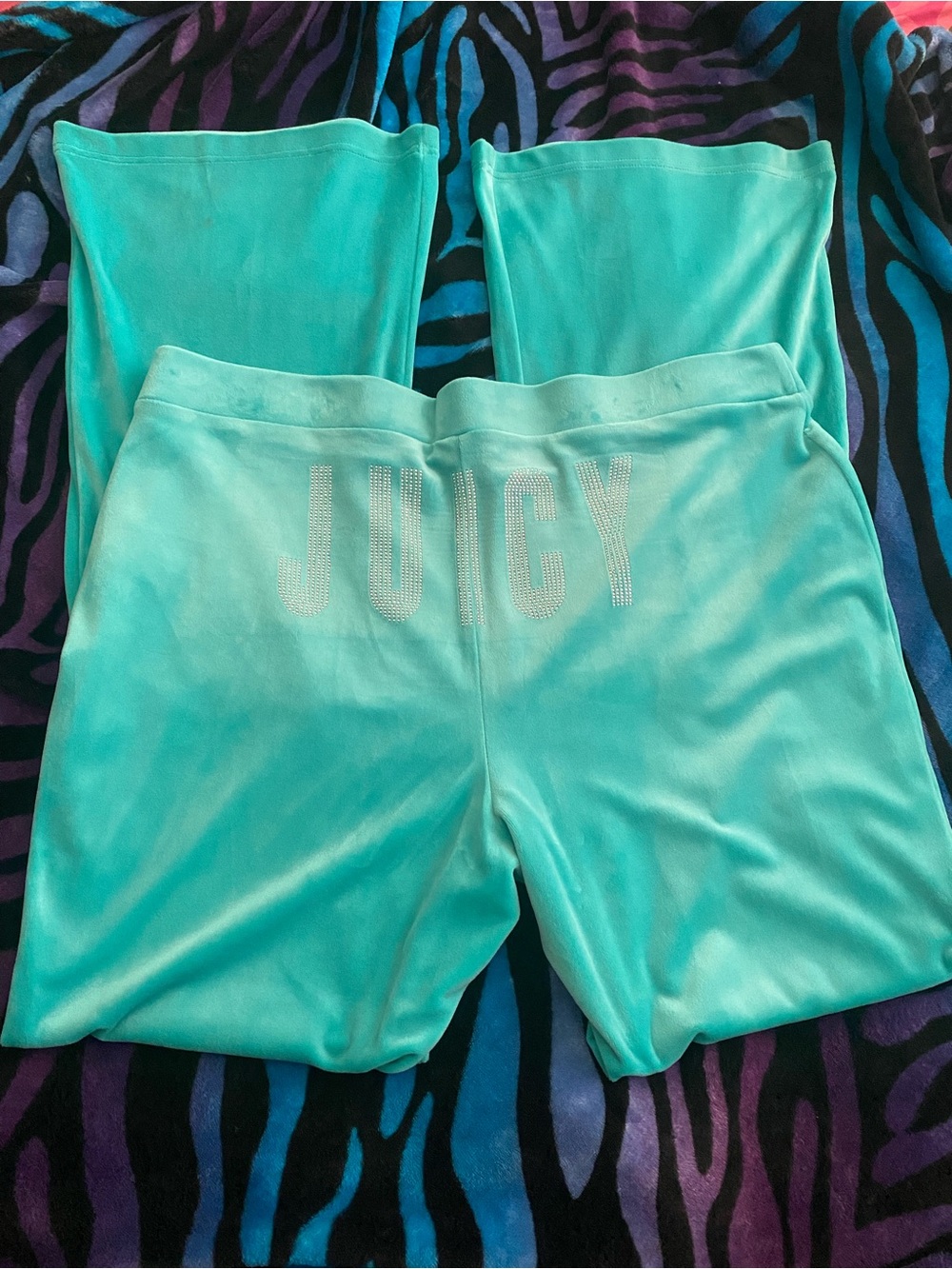 Teal aqua Juicy Couture velour pants with sparkly logo design on back